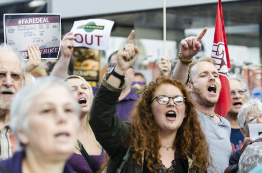 Brighton, East Sussex, 14th June 2016. Commuters hold a protest at Brighton Rail Station after suffering weeks of severe disruption due to staffing problems. Staff have been on strike and calling in sick due to disputes over Southerns proposed move to dri