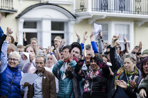 Brighton, East Sussex, 13th June 2016. LGBTQ communities gather for a procession and vigil at Brighton’s Aids Memorial Sculpture at New Steine in Kemptown, in memory of and in solidarity with the 49 people killed and others injured at Pulse gay bar in O