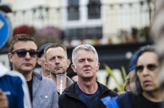 Brighton, East Sussex, 13th June 2016. LGBTQ communities gather for a procession and vigil at Brighton’s Aids Memorial Sculpture at New Steine in Kemptown, in memory of and in solidarity with the 49 people killed and others injured at Pulse gay bar in O