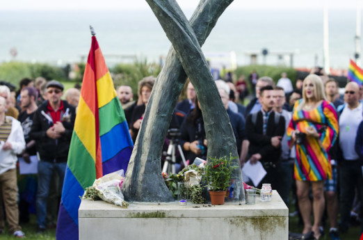 Brighton, East Sussex, 13th June 2016. LGBTQ communities gather for a procession and vigil at Brighton’s Aids Memorial Sculpture at New Steine in Kemptown, in memory of and in solidarity with the 49 people killed and others injured at Pulse gay bar in O