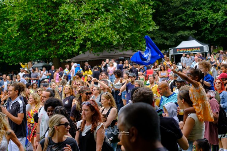 A crowd dancing and a Brighton and Hove Albion flag