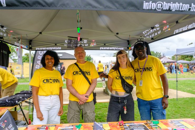 The Barco team standing together in their yellow event tshirts