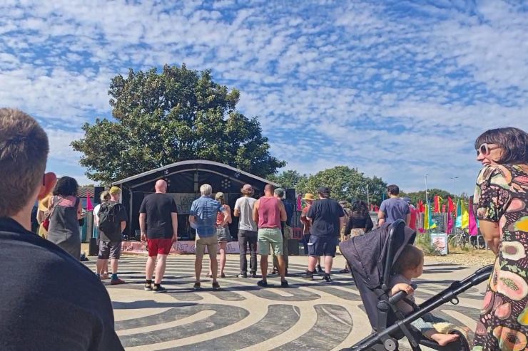 Crowd and stage in sunshine